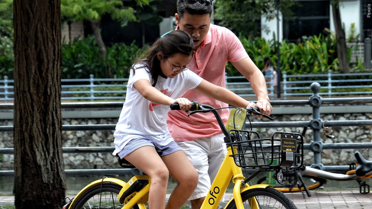 Girl-riding-bike-beside-her-dad_parents-logo__Pexels-z380Zf.jpg
